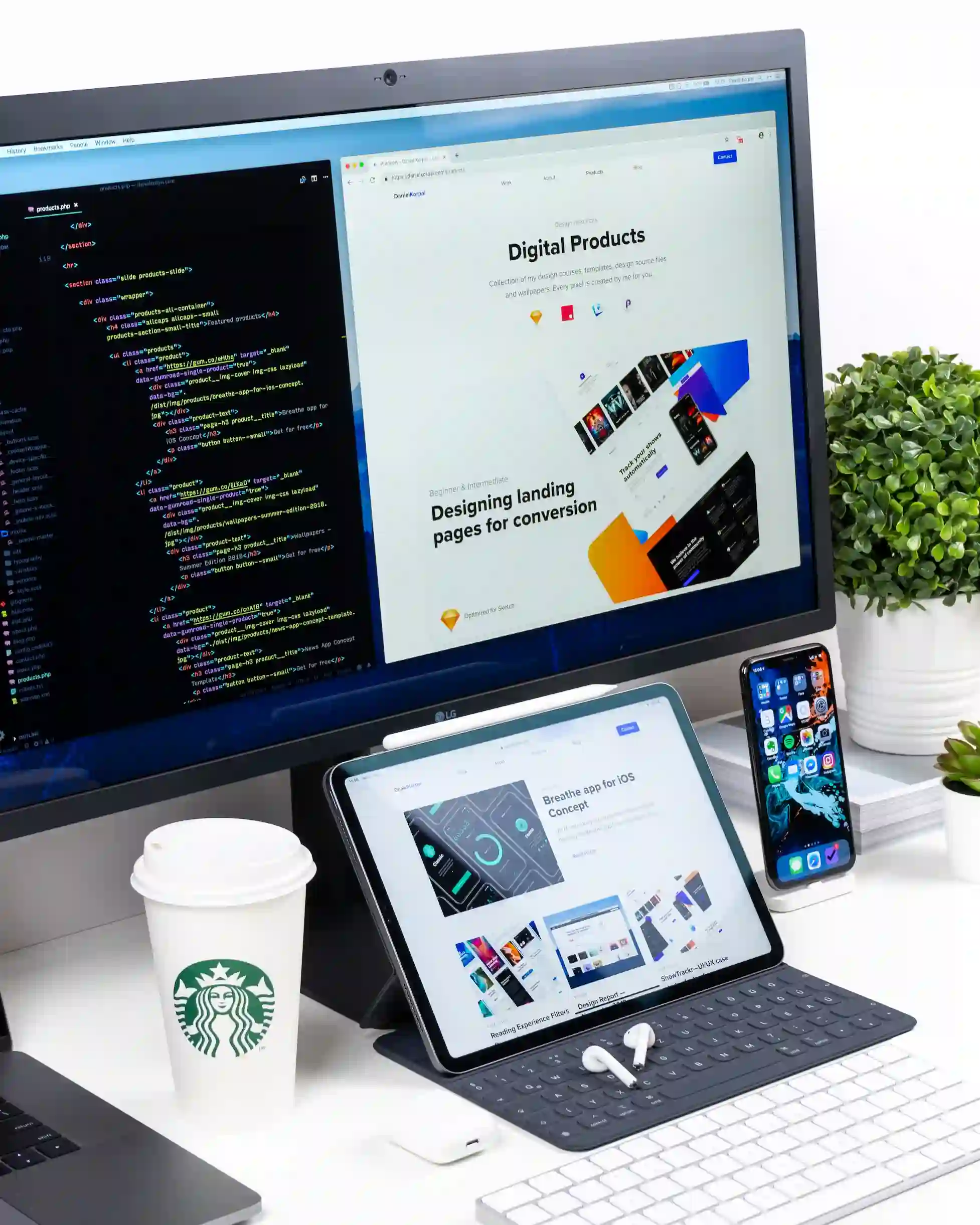 phone, tablet, and a computer with html code and a website